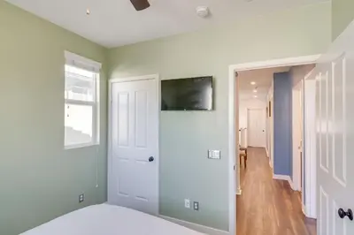 a room with green walls and a white door at Home Theater System and Gazebo Los Angeles Getaway! in San Fernando