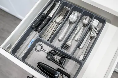 a drawer filled with utensils in a drawer at Newly Remodeled 3BR Apt | Mins to Disney | Arcade in Placentia