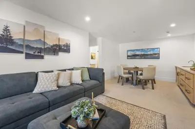 a living room with a couch and a table at Skyline Summit Lodge in Big Bear Lake