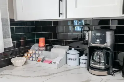 a kitchen counter with a coffeemaker and a coffee maker at Star Wars Retreat by OC Adventure Homes in Garden Grove