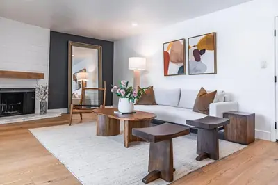 a living room with a couch and a table at Cozy Modern Haven w Soothing Ambience & Pool in Fullerton