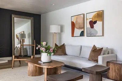a living room with a couch and a table at Cozy Modern Haven w Soothing Ambience & Pool in Fullerton