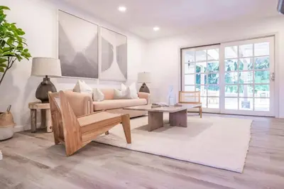 a living room with a couch and a table at Marbella Lane - Serene Ranch Style Home wPool in Fullerton