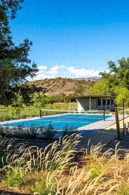 a swimming pool in front of a house at Ojai Valley - Pool and Pickle Ball in Ojai