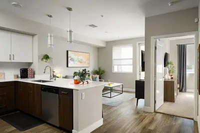 a kitchen with a sink and a counter top at The Mandarin at Main Place - Free Disney Gift Gard in Orange