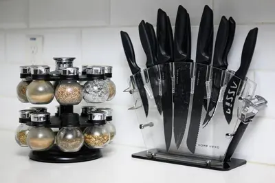 a kitchen counter with a bunch of knives and spices at The Mandarin at Main Place - Free Disney Gift Gard in Orange