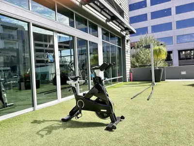 a exercise bike parked in front of a building at Casa Clementine - 10 min to SNA&Beach Plus Free Parking in Orange
