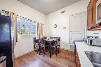 a kitchen with a table and chairs in a kitchen at Welcoming & Spacious 2-Bedroom Guest Suite in Torrance 20 Minutes from LAX in Torrance