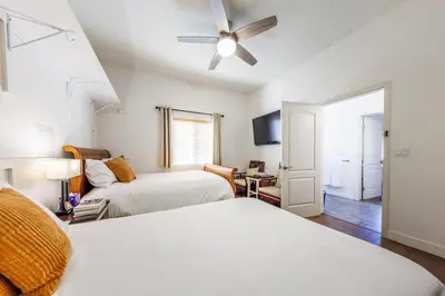 a bedroom with two beds and a ceiling fan at Welcoming & Spacious 2-Bedroom Guest Suite in Torrance 20 Minutes from LAX in Torrance