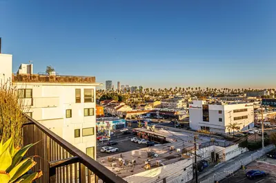 a view of a city from a balcony at Luxury 1BD Condo in LA with Rooftop City Views, Gym & Free Parking in Los Angeles