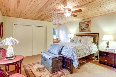 a bedroom with a bed with a wooden ceiling at Quiet Home Less Than 1 Mi to Lake Gregory and Dtwn Crestline in Crestline