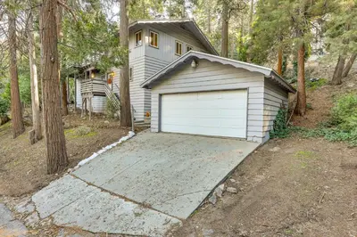 a garage in front of a house at Quiet Home Less Than 1 Mi to Lake Gregory and Dtwn Crestline in Crestline
