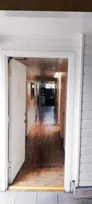 an empty hallway of a house with a door open at Soul in Los Angeles close to Downtown in Los Angeles