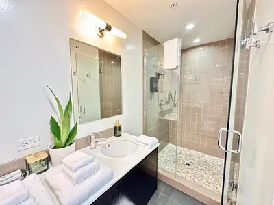 a bathroom with a sink and a shower at The Gallery Spacious 2BD 2BA with Two King Beds in Los Angeles