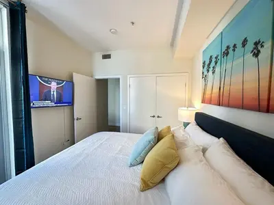 a bedroom with a large white bed with pillows at 2 King Beds DTSM! Walk to Pier, Promenade & Beach in Los Angeles