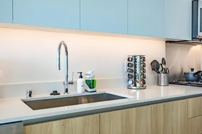 a kitchen with a sink and a counter top at Marbella Lane - Sleek Corner Ocean View in Long Beach