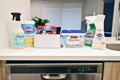 a kitchen counter with various cleaning products on it at 2 KING BED LUXURY WALK to BEACH, PIER & PROMENADE in Los Angeles