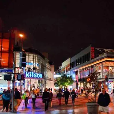 a group of people walking down a city street at night at Fully Equipped DTSM Studio, Blocks to Ocean & Pier in Los Angeles