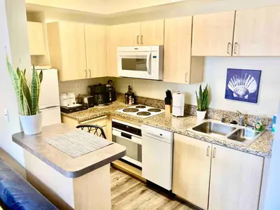 a kitchen with a sink and a stove top oven at Heart of DT SM Studio, Walk To Beach & Pier in Los Angeles