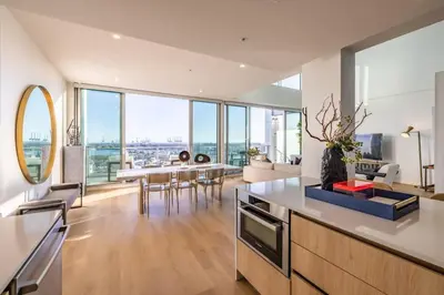 a kitchen and living room with a view of the city at Marbella Lane - Luxurious 3BR Penthouse in Long Beach