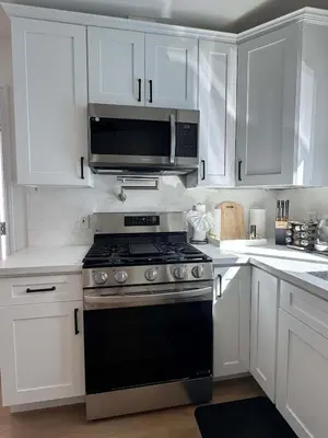 a kitchen with a stove and a microwave at Marbella Lane - Lovely DWNTN Getaway LongBeach in Long Beach