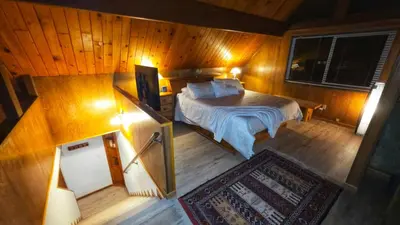 an overhead view of a bedroom with a bed at Cozy Cabin Retreat with a Hot Tub in Running Springs