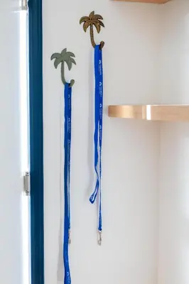 two blue ribbonamental palm trees hanging on a wall at Cozy Private 1BR Near LAX & SoFi, Pet-Friendly in Los Angeles