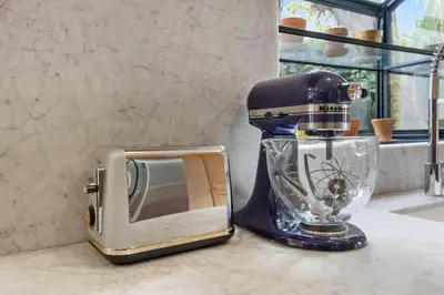a mixer sitting next to a microwave on a counter at New Listing Venice Villa by Colby & Conrad in Los Angeles