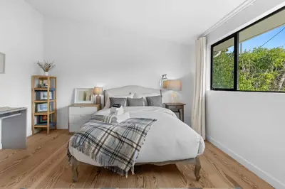 a white bedroom with a bed and a window at New Listing Venice Villa by Colby & Conrad in Los Angeles