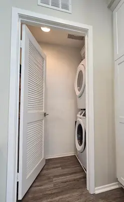 a laundry room with a washer and dryer at The Savi Suite in Corona
