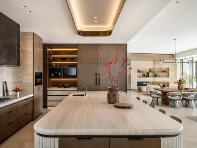a kitchen with a large wooden table in a room at Stradella Mansion in Los Angeles