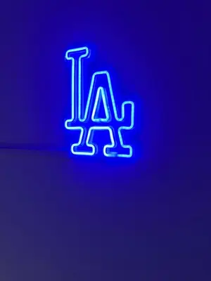 a neon sign with the letter l on a purple at Comfortable & Quaint Room in a Shared Space in Van Nuys