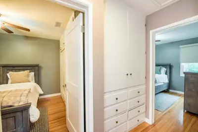 a bedroom with a bed and a closet at Welcome to your home at the Orange Circle in Orange