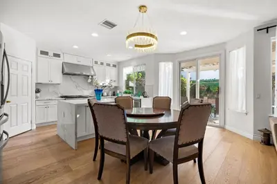a kitchen with a dining room table and chairs at Luxury Hilltop Home Spacious Private Backyard in Rowland Heights