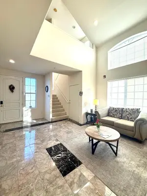 a living room with a couch and a table at Spacious 3BR 3BA Home 3 Car Garage Garden Near DTLA Pasadena Hollywood in Alhambra