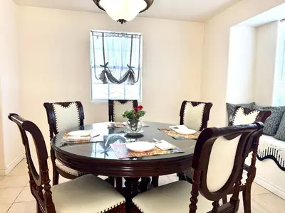 a dining room with a table and chairs at Spacious 3BR 3BA Home 3 Car Garage Garden Near DTLA Pasadena Hollywood in Alhambra