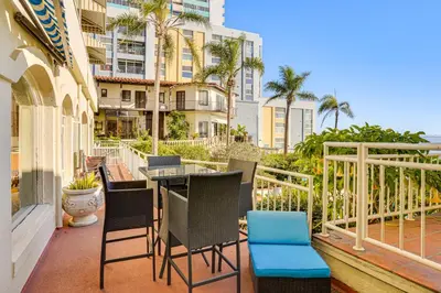 a balcony with chairs and a table on a balcony at Beachfront Living in Long Beach 2,500 Sq Ft Condo in Long Beach