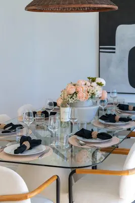 a glass table with plates and flowers on it at New Listing Sunset Retreat by Colby&Conrad in Los Angeles