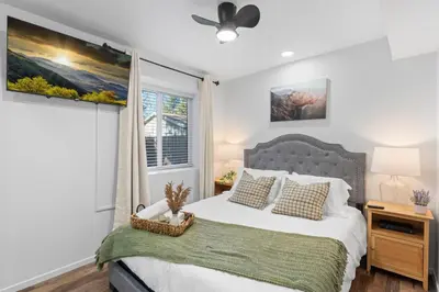 a bedroom with a bed and a window at Tall Pines Retreat Large Patio w BBQ and Firepit! in Big Bear City Airport