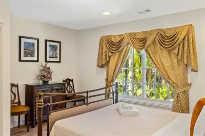 a bedroom with a bed and a window at Marbella Lane - Tranquil Country Escape Getaway in Placentia