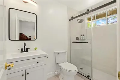 a bathroom with a toilet and a sink and a shower at Marbella Lane - Tranquil Country Escape Getaway in Placentia