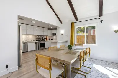 a kitchen and dining room with a table and chairs at Bel Air Very Private and Comfy Home with Jacuzzi in Los Angeles