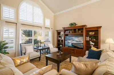 a living room with two couches and a tv at Marbella Lane - Captivating Home w Pool in Rowland Heights