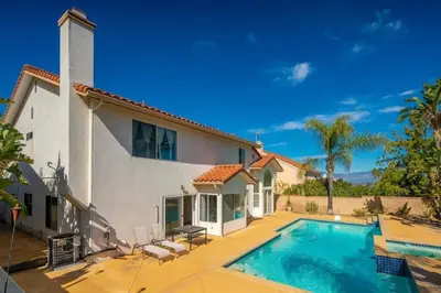 a house with a swimming pool in front of it at Marbella Lane - Revitalizing Getaway w Pool in Rowland Heights