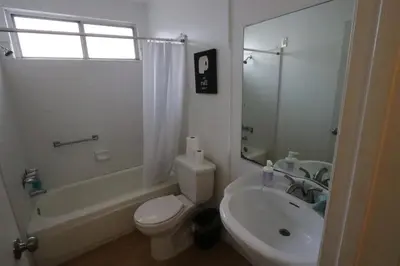a bathroom with a white toilet and a sink at 3 beds Apart in Beverly Hills Neighborhood in Los Angeles