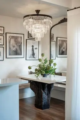 a dining room with a tree stump table and a chandelier at Luca's Tree Flat - Los Angeles California in Studio City