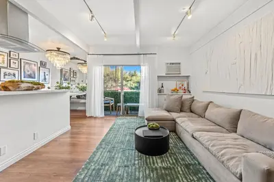 a living room with a couch and a table at Luca's Tree Flat - Los Angeles California in Studio City