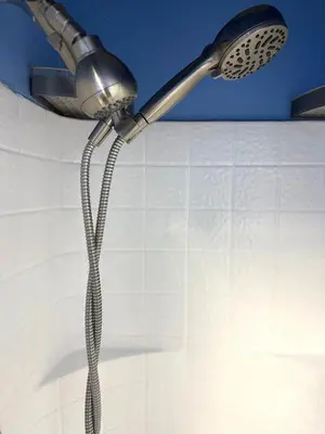 a shower head with a hose hanging from a ceiling at Larchmont 1875 sq ft house 3 bed 2 bathroom in Los Angeles