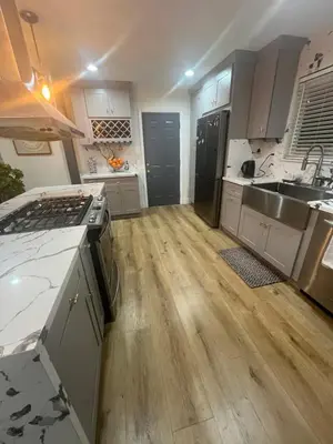 a kitchen with a sink and a stove top oven at Minimalist Room in Buena Park in Buena Park