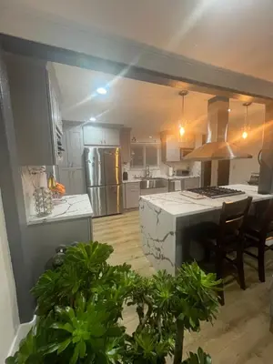 a large kitchen with a large island in a room at Minimalist Room in Buena Park in Buena Park